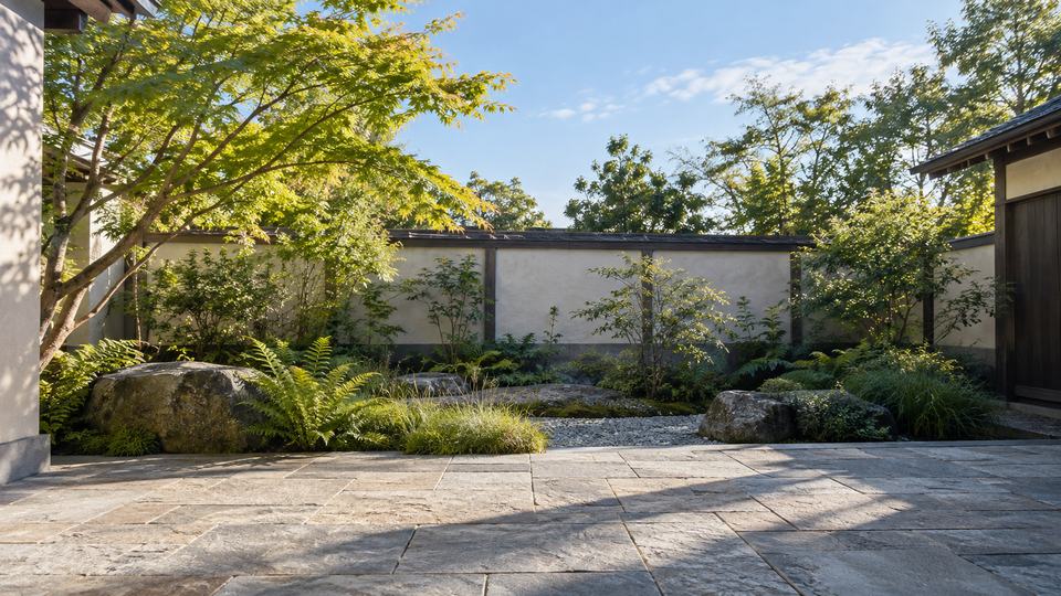 A secluded courtyard garden with stone paths and greenery; clear morning in Daylight
